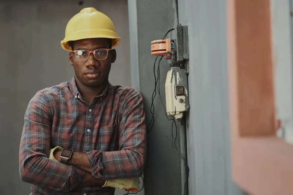 HVAC technician installing an air conditioning unit in Dubai